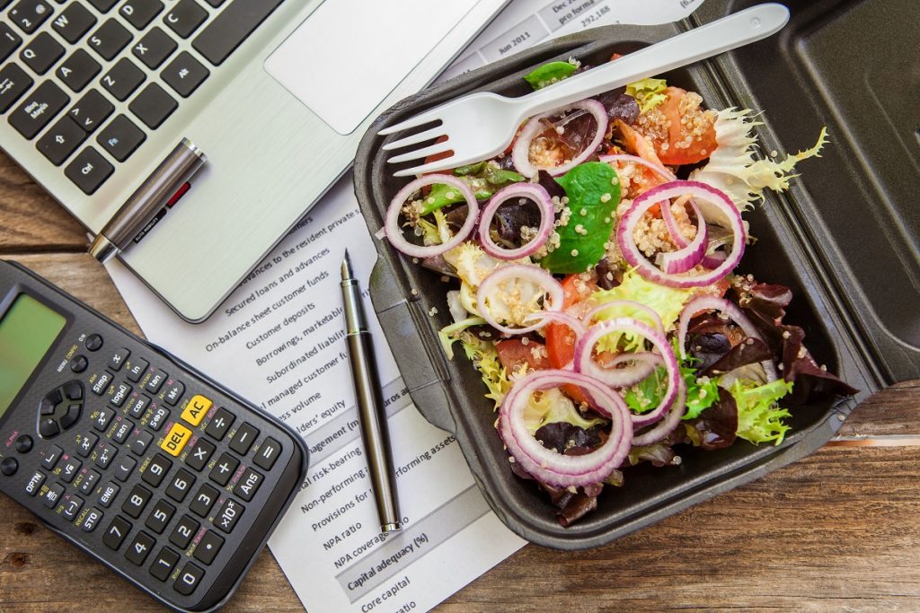 Packed meal beside a calculator