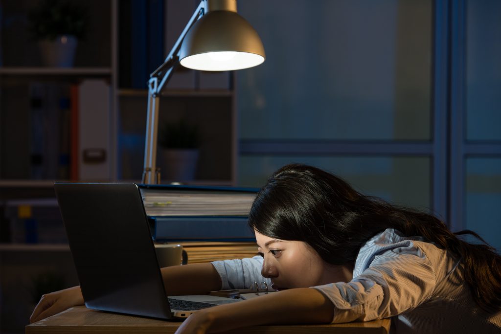 exhuasted woman working at night