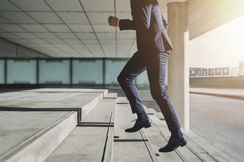 Businessman running upstairs