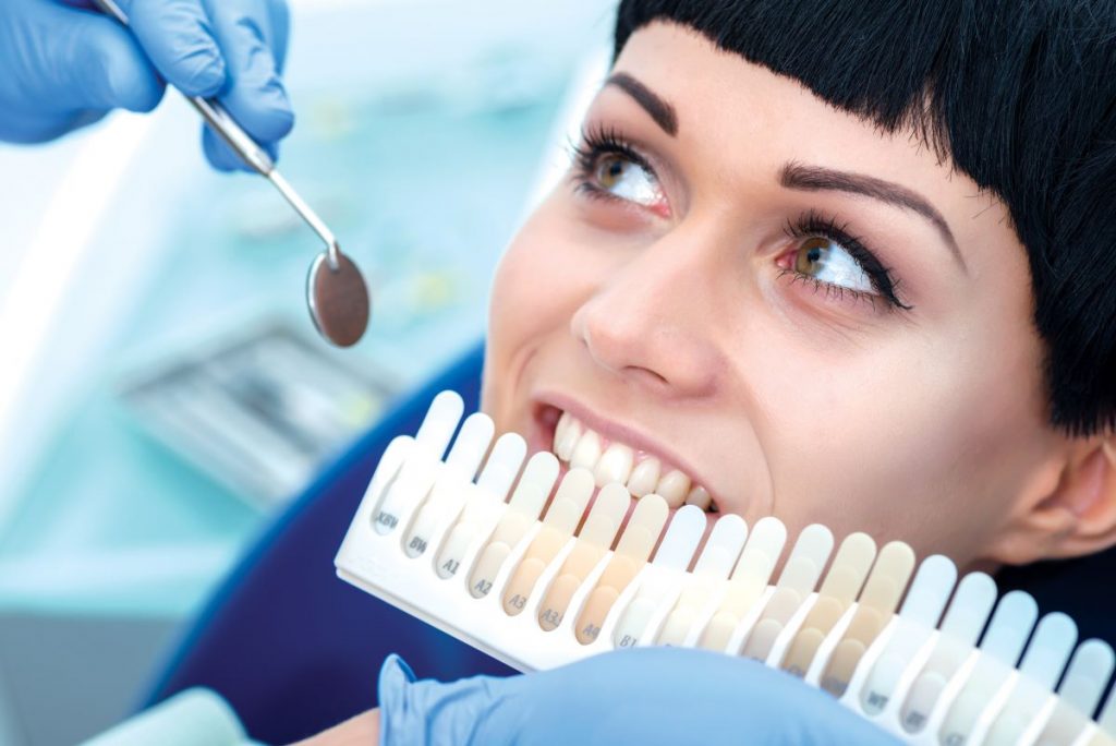 woman getting work done on her teeth