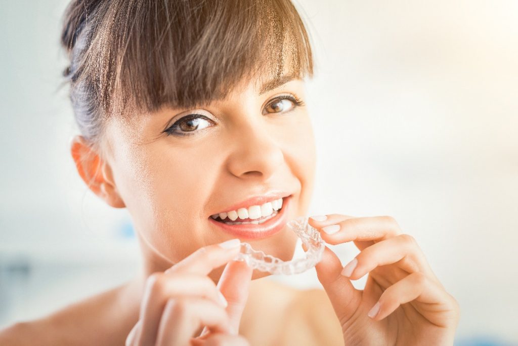 woman wearing invisalign