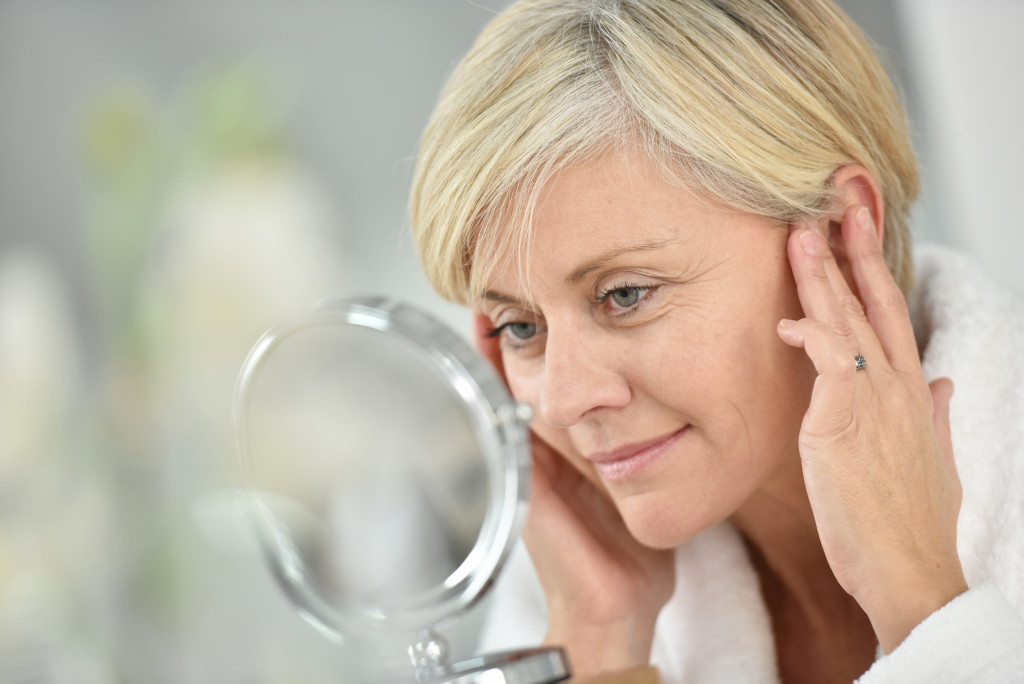 a woman touching their face