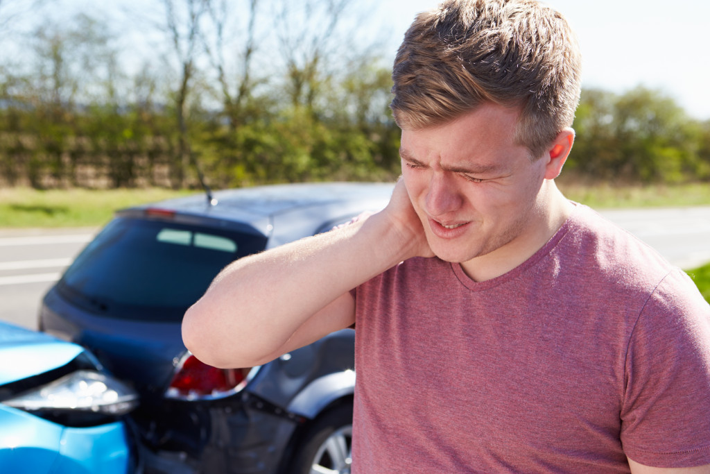 A driver suffering from whiplash after a car collision