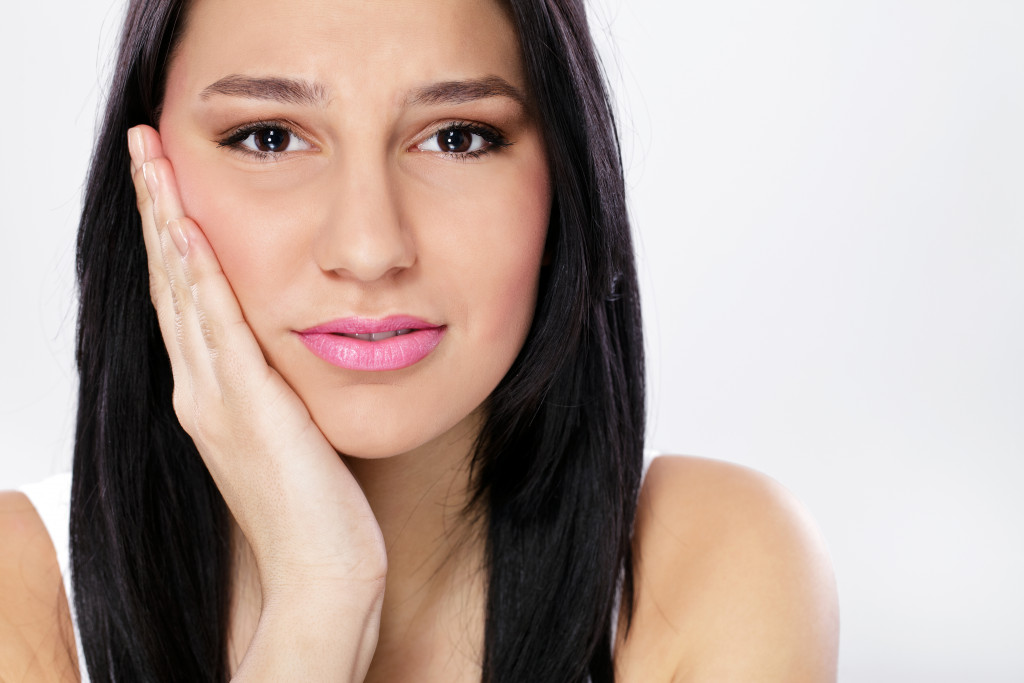 Woman experiencing Jaw pain