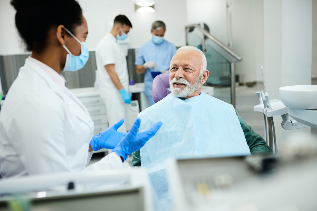 a senior man getting dental treatment