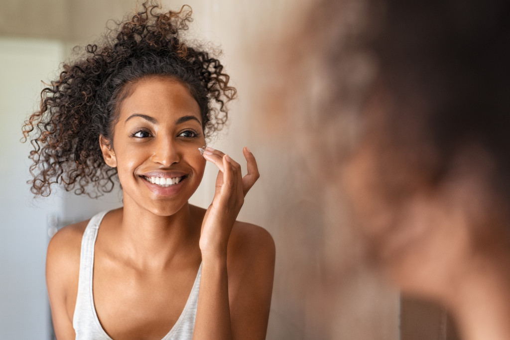 african american woman doing skincare