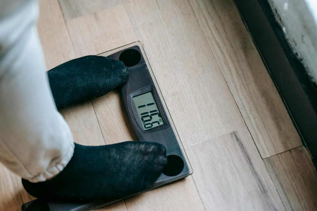 person on weight scales